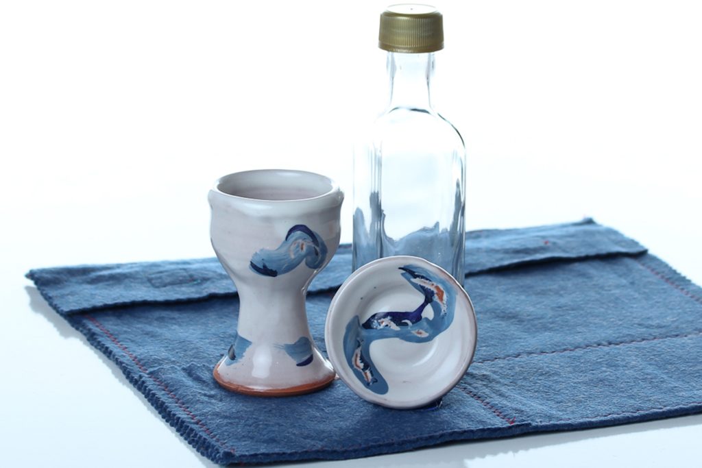 Handthrown and decorated ceramic communion chalice (approx. 3 1/2 inches tall) and paten (approx.2 1/4 inches diam.) These can be sanitized in the dishwasher when needed.
