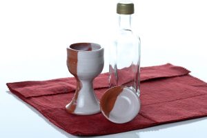 Handthrown and decorated ceramic communion chalice (approx. 3 1/2 inches tall) and paten (approx.2 1/4 inches diam.) These can be sanitized in the dishwasher when needed.